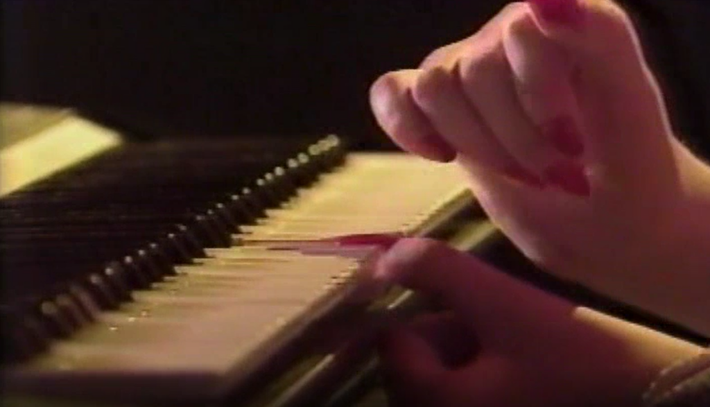 Jenny Smith playing piano after a spinal cord injury